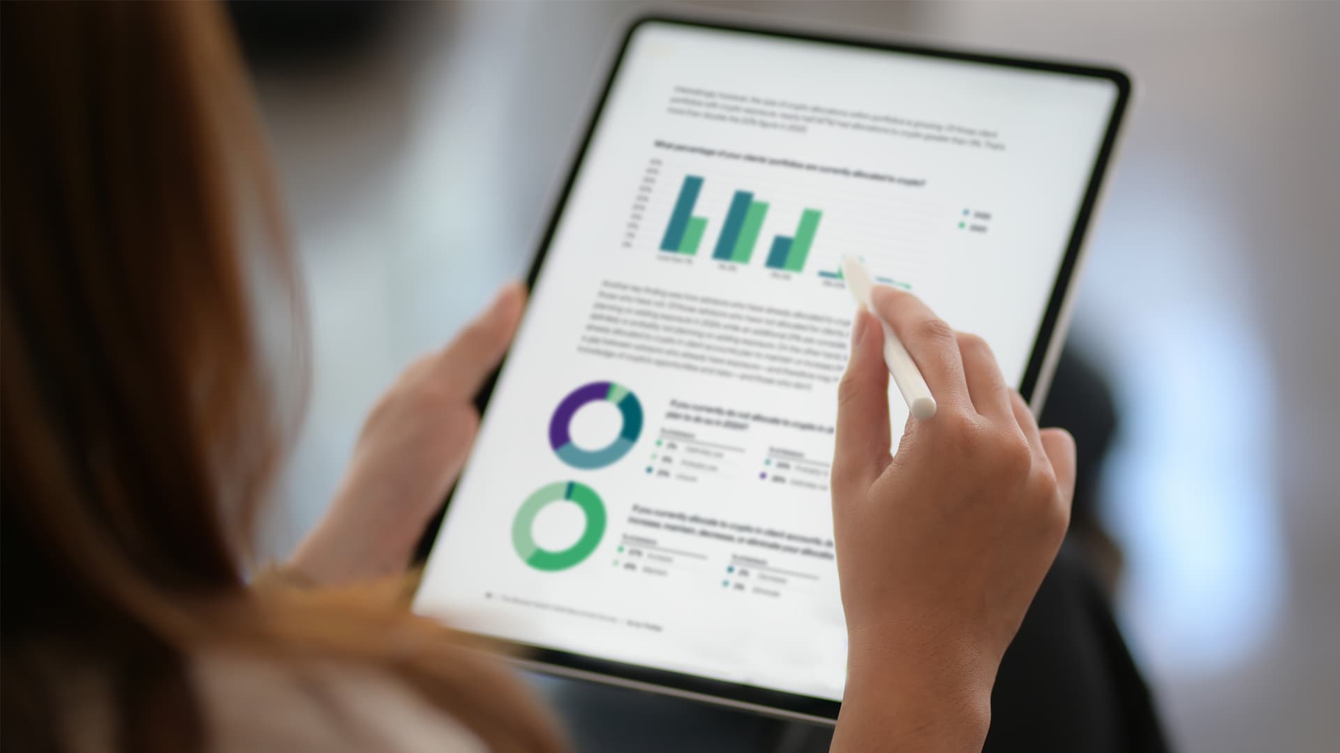 Woman holding ipad with benchmark survey